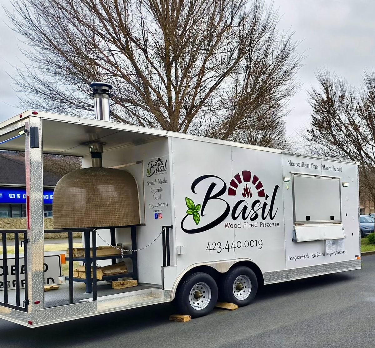 The Basil Wood Fired Pizzeria trailer with its wood-fired oven